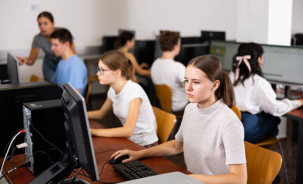 istock Teenager girl using PC during computer science lesson 1447782658