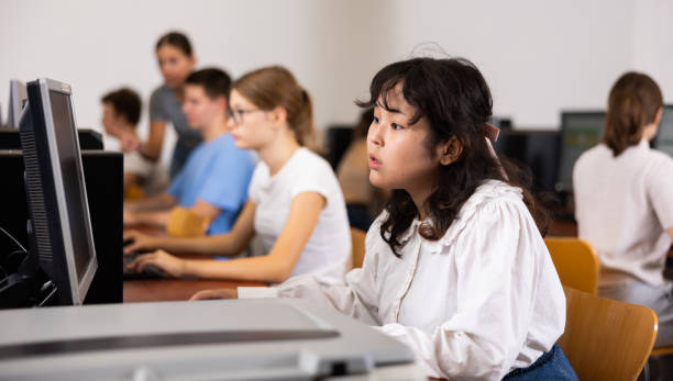 istock Teenager girl using PC during computer science lesson 1447782666
