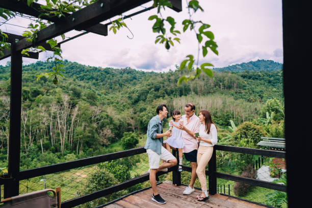 happy family enjoying on a terrace of weekend house - great grandchild imagens e fotografias de stock