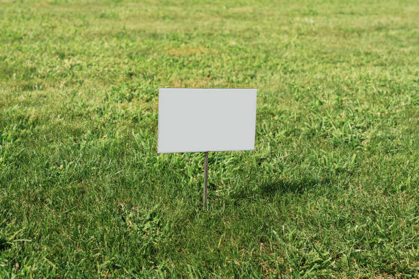 istock Blank information sign board mounted on lawn green grass 1447786388