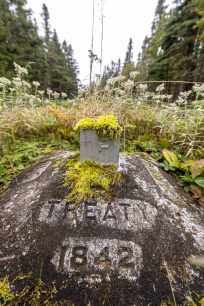 Weathered boundary monument indicating USA Canada border