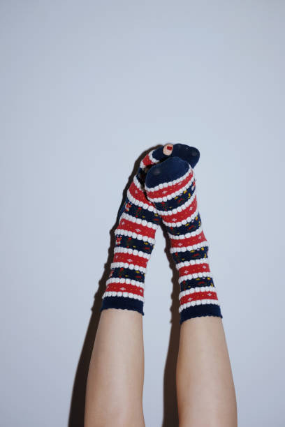 legs in christmas socks raised up on grey in Gomel, Gomel Region, Belarus