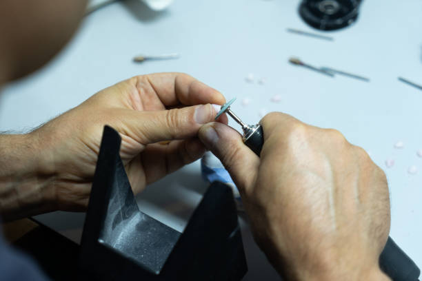 istock dental technician creates dental prostheses. laboratory. close-up. 1447796567