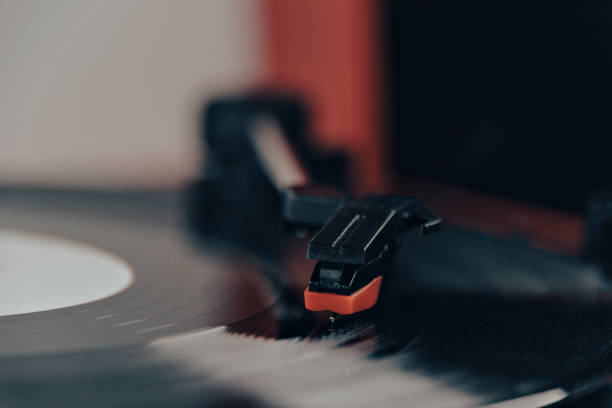 istock Close-up, vintage record player, While playing the record, Black platter. 1447798553