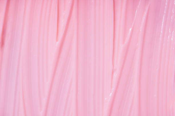 istock Pink cream or lotion texture as background with copy space for text. Cream smears. Natural skincare product 1447800807