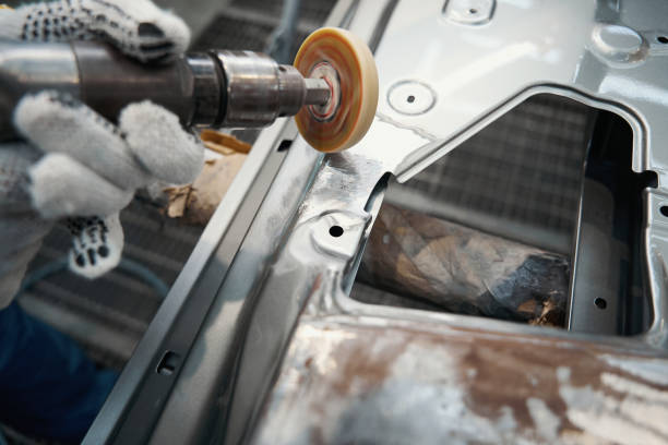 istock Worker cleaning surface of auto, prepare for repair 1447801851