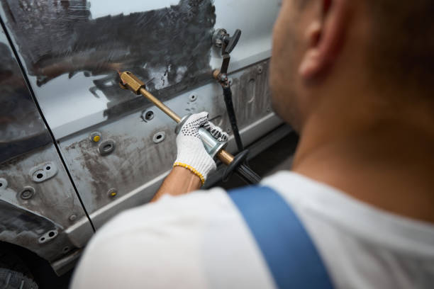 istock Male cleaning surface before applying new paint 1447801997