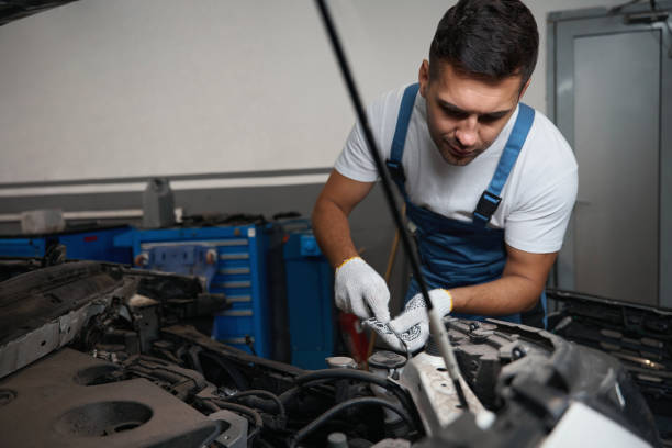 istock Portrait of young man doing car repairs 1447802005