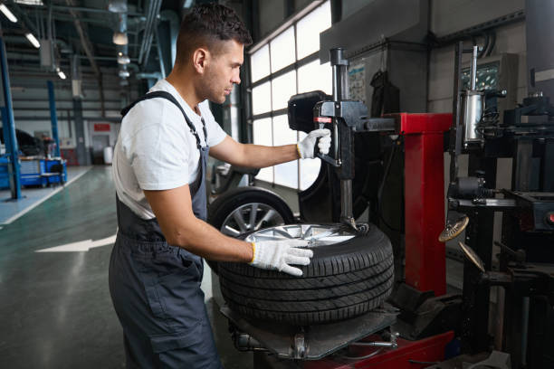 istock Professional male checking technical condition of car wheel 1447802070