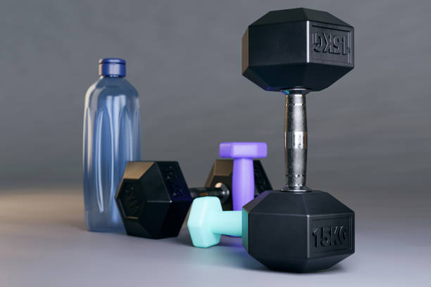 istock Dumbbell weights and water canteen in the gym 1447803848