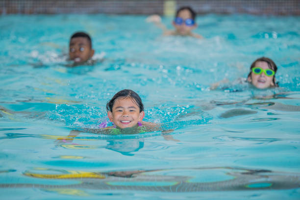 istock Children at a Swimming Lesson 1447805686