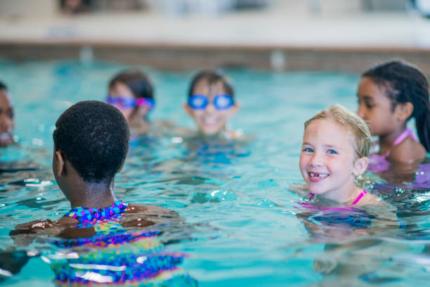 istock Children at a Swimming Lesson 1447805691