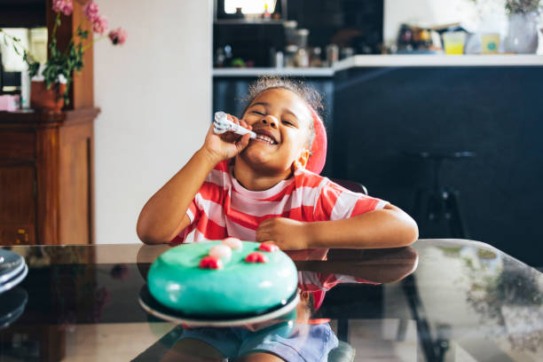 istock A Cute Little Girl Smiling While Looking At Camera 1447806576