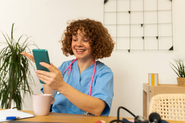 istock Female doctor talking with colleagues through a video call 1447807427