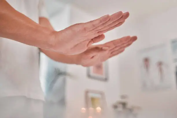 Reiki, massage and spa wellness hands for luxury, relax and peach consultation in physical therapy. Beauty therapist doing a health, body and holistic luxury treatment for calm and healthy zen care