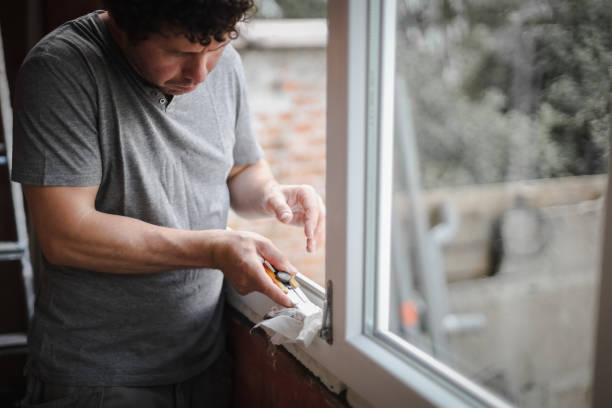 istock Caucasian man cleans the window frame. 1447813967