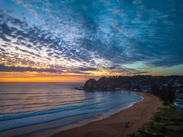 istock Beautiful sunrise with clouds over the ocean 1447816925