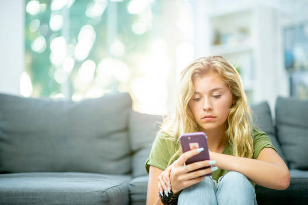 istock Teen on Her Cell Phone 1447818922
