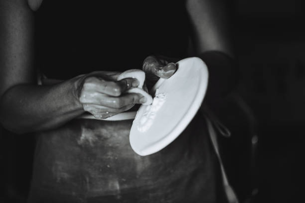 Pottery manufacturing process , man’s ,hands ,make a Sake bottle