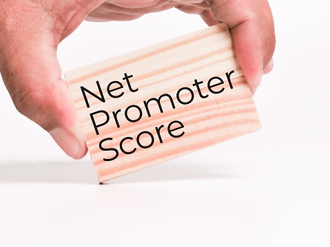 NPS net promoter score concept written on wooden blocks.