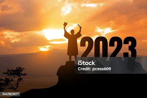 istock Silhouette Young man Graduation in 2023 years, education congratulation concept, Freedom and Happy new year, success in the future goal and passing time.copy space. 1447821077