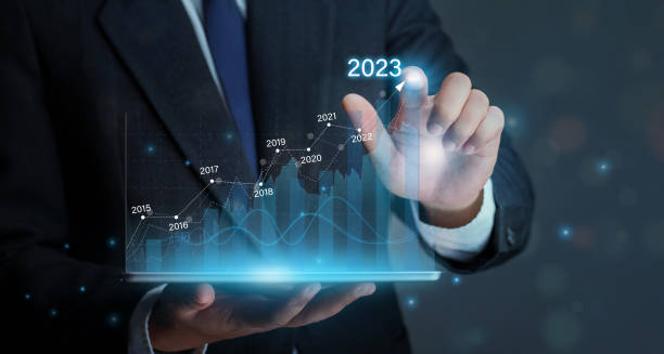 istock Businessman holding tablet with draws increase arrow graph corporate future growth year 2022 to 2023.Planning,opportunity, challenge and business strategy. Development to success and growth business. 1447821094