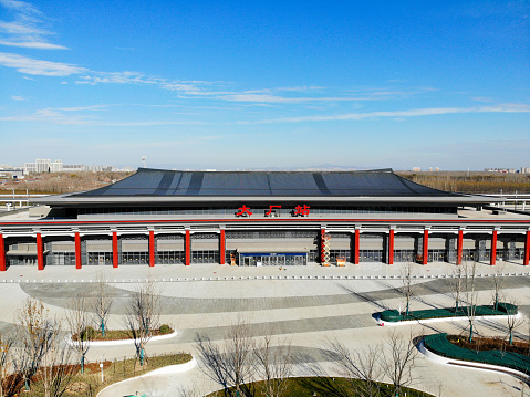 Langfang, Hebei, China- November 26, 2022: China has built lots of high speed railways in rencent years. Now there is a brandnew highspeed railway (planned to be put to use in the end of 2022) from Beijing to Tangshan, 200km east to Beijing and the biggest city in Hebei Province. Here is the aerial view of the station house of Dachang county, Langfang.