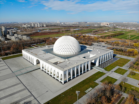 Dachang County, Langfang, Hebei, China- November 26, 2022: Dachang is a Hui Nationality Autonomous County in Langfang city, Hebei Province. There is a well designed Palace of Nationalities in Muslim style. It looks like a white mosque. Here is the aerial view of the Palace.