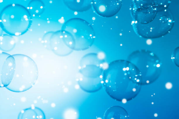 istock Abstract Beautiful Transparent Blue Soap Bubbles Background. Defocus, Blurred Celebration, Snowfall, Circles. Freshness Soap Sud Bubbles 1447826904