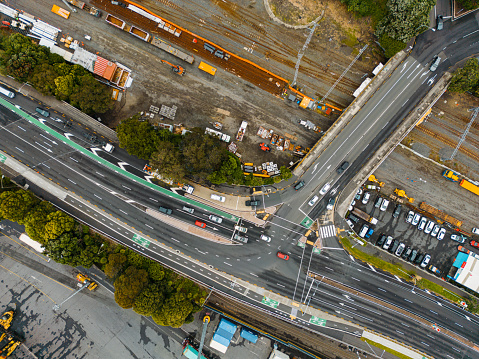 Drone aerial view of railway next to highway and port.