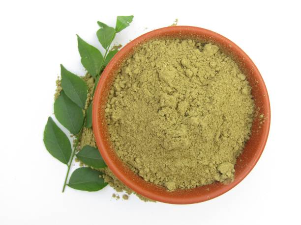 istock Curry leaves powder in a bowl on white background 1447832530