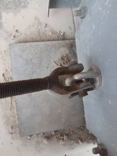 istock a steel building structure with bolts and concrete supports 1447836852