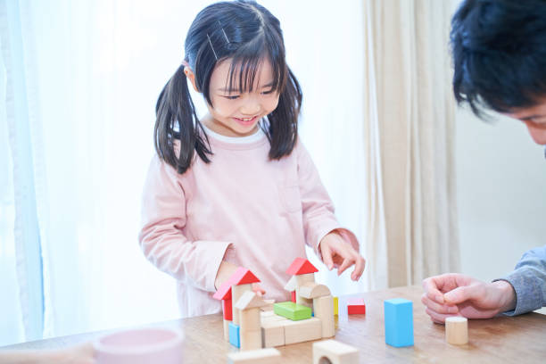 istock Parents and their child playing together 1447836870