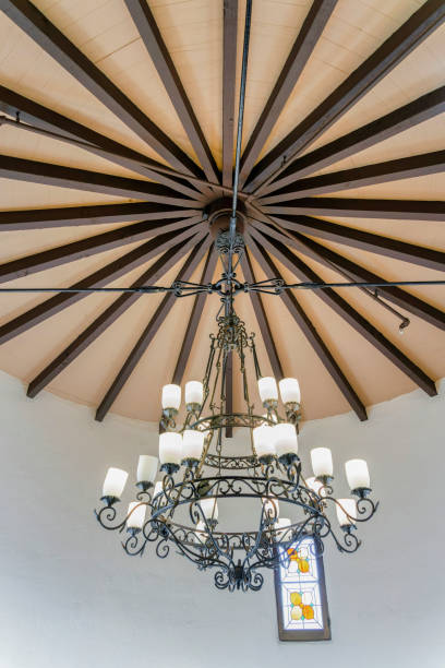 istock Uplight wrought iron chandelier on a round ceiling at San Clemente, California 1447840169