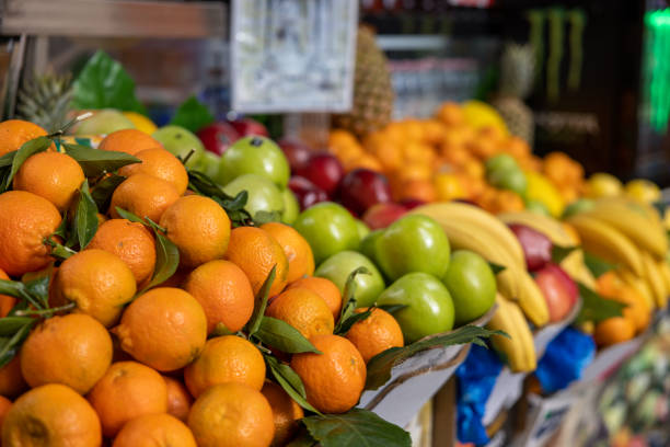istock Fruit stand, Rome, Italy, with apples, oranges, and bananas 1447840335
