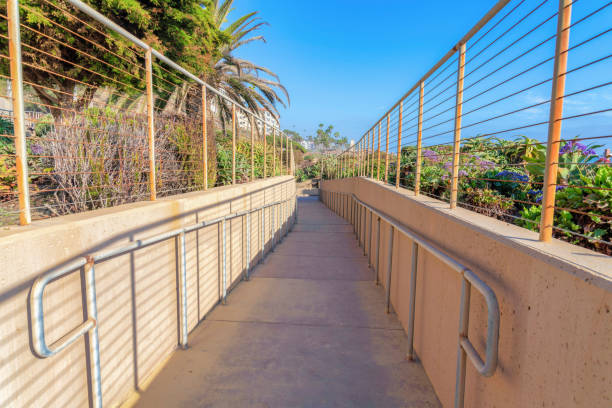 istock Pathway in between the walls with cable fence at San Clemente, California 1447843357