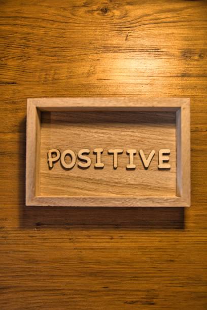 istock Positive Good Vibes Text Inside Wooden Shadow Box with Darker Wood Background 1447844159