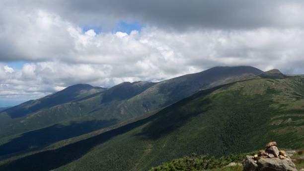istock Beautiful shot of mountain range under cloudy sky 1447844320