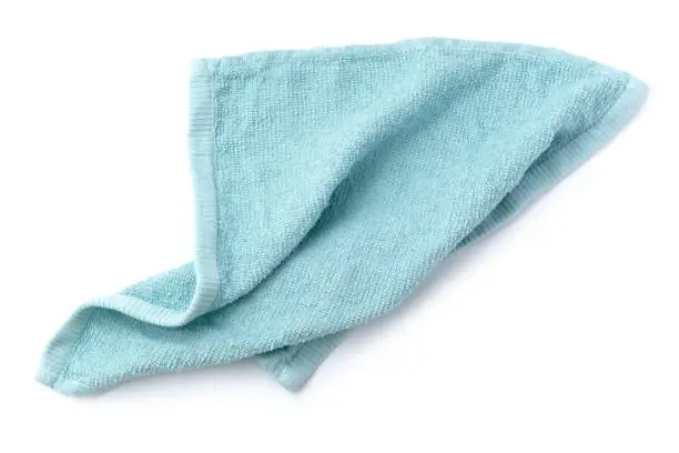 Blue towel isolated on white background, top view