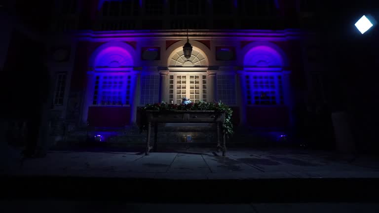 Camera approaching to a vintage table of a wedding cake setting beautifully decorated with flowers