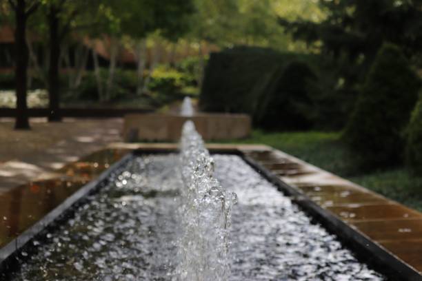 istock Fountain with splashing water in the park 1447847780