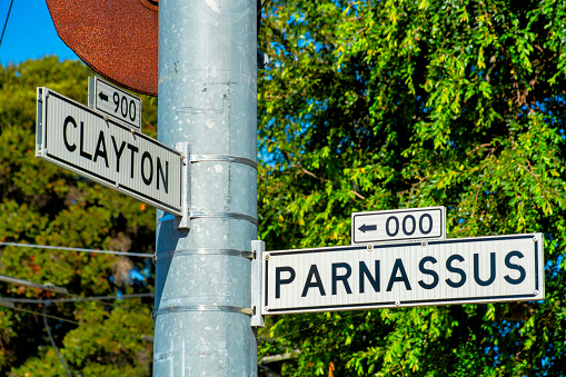 Close up blank street name signs over white