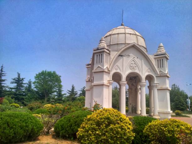 istock Beautiful white building in a park with a blue sky in the background 1447850073