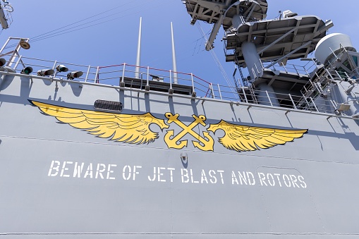 Los Angeles, United States – May 30, 2022: A closeup shot of the beware of jet blast and rotors sign on the deck of the USS Bonhomme Richard