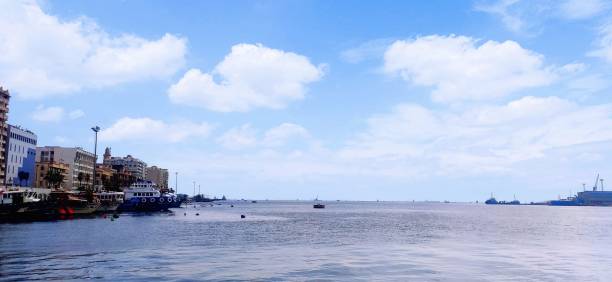 istock Blue sky over the sea with a port in spring 1447851415