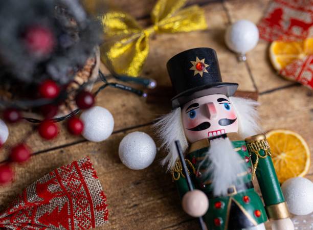 istock Wooden nutcracker toy on the table with Christmas decorations 1447854583