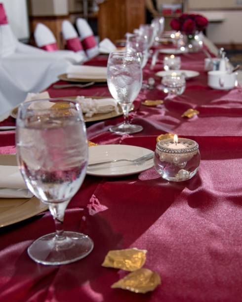 istock Vertical shot of a red wedding table with cutlery and arrangements 1447856494