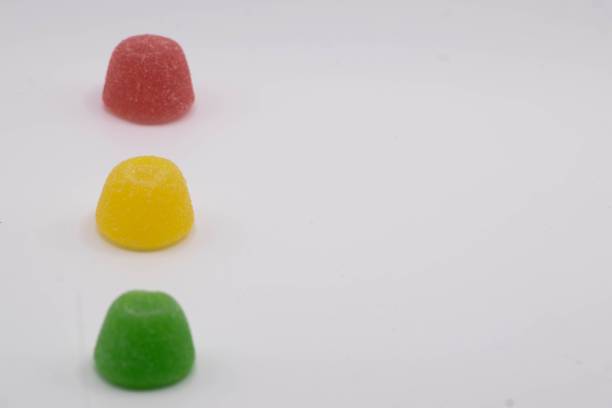 istock Colorful candies isolated on white background with copy space 1447859020