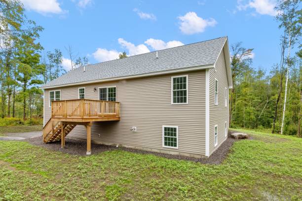 istock Grey modern construction of contemporary raised ranch surrounded by trees 1447859366