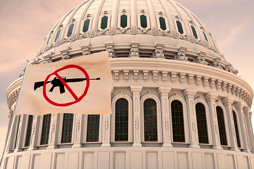 Beautiful flag of the Assault Weapons Ban, BAN GUNS waving with the strong wind and behind it the dome of the Capitol USA 3D RENDER, 3D RENDERING.